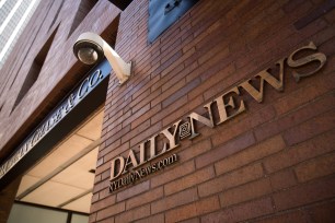 Signage for the New York Daily News is displayed on the facade of their Broad Street office.