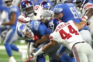 Giants linebacker Mark Herzlich (44) was called for a 15-yard penalty on this sack of Jake Rudock during the Giants' 30-17 preseason victory Friday night.