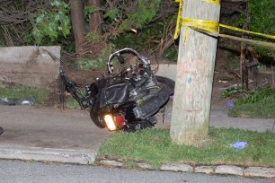 Police investigate the scene of a fatal motorcycle accident in Queens.