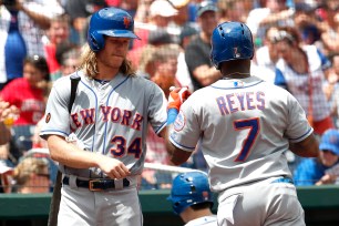 Noah Syndergaard congratulates Jose Reyes after a home run.