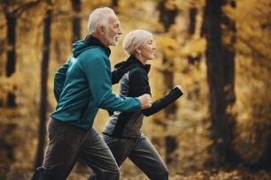 Two senior citizens jogging