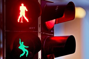 Walking figures depicting late US rock and roll legend Elvis Presley appear on a traffic light switching from green to red.