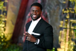 FILE - In this Dec. 11, 2017 file photo, Kevin Hart arrives at the Los Angeles premiere of "Jumanji: Welcome to the Jungle" in Los Angeles. Hart will host the 2019 Academy Awards, fulfilling a lifelong dream for the actor-comedian. Hart announced Tuesday, Dec. 4, 2018, his selection in an Instagram statement and the Academy of Motion Picture Arts and Sciences followed up with a tweet that welcomed him "to the family." (Photo by Jordan Strauss/Invision/AP, File)