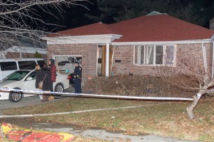 Authorities at the scene of the fatal fire in Queens.