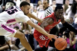 Providence's Drew Edwards (left) looks to knock the ball away from Greg Williams Jr. during St. John's 78-59 loss on Wednesday night.