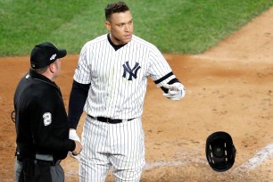 Aaron Judge tosses his helmet after striking out to end the sixth inning in the Yankees' Game 4 loss to the Astros on Thursday night.