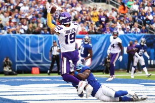 Adam Thielen catches a touchdown against DeAndre Baker in the third quarter of the Giants' 28-10 loss to the Vikings on Sunday.