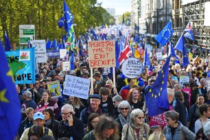 People take part in an Anti-Brexit, Let Us Be Heard march as they head to Parliament Square in London.