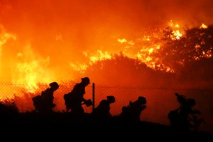 Firefighters battle the Saddleridge fire in Sylmar, Calif