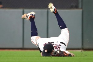 Josh Reddick makes a diving catch on a Brett Gardner line drive in the sixth inning of the Yankees' 6-4 season-ending loss in Game 6 of the ALCS on Saturday night.