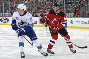 Quinn Hughes (l) and Jack Hughes