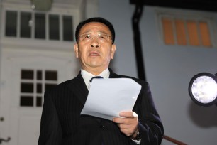 North Korean negotiator Kim Miyong Gil reads statement outside the North Korean Embassy in Stockholm, Sweden.