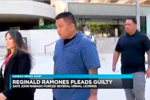 John Rabago, center, outside federal court in Honolulu.