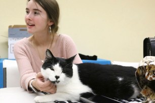 Hannah Rountree is pictured with her cat Spunky