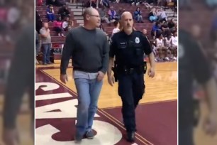 Unruly fan removed from basketball game for racist outburst