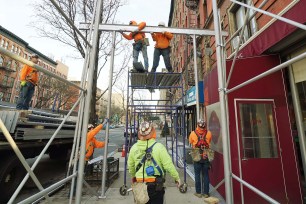 Scaffolding being installed at 1627 Amsterdam Ave. on Tuesday.