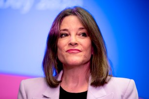 Marianne Williamson pauses while speaking at a the Faith, Politics and the Common Good Forum in Des Moines, Iowa.