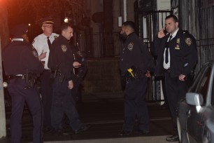 Police gather outside 2785 W. 15 Street