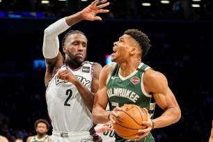 Giannis Antetokounmpo, who scored 29 points, drives on Taurean Prince during the Nets' 117-97 blowout loss to the Bucks on Saturday night.