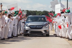 Workers in Alabama celebrate the start of production for the Odyssey by Honda — an international success story, according to Fred Hochberg, author of “Trade Is Not a Four-Letter Word.” The Japanese car is made up of 75 percent US-built parts.