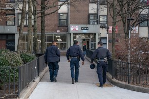 NYPD officers investigate a shooting inside the Fort Independence Houses at 3340 Bailey Ave. in the Bronx.