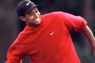 Tiger Woods celebrates after winning the 1997 Masters.