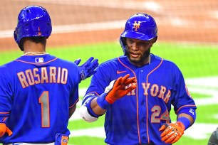 Amed Rosario (l) and Robinson Cano