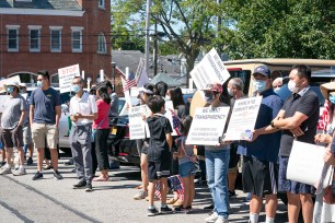 Jericho residents protesting against a hotel being turned into a homeless shelter.