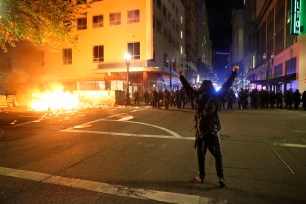 Young white activists cosplay as revolutionaries on the streets of Portland.