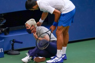 U.S. open lineswoman Laura Clark, who was struck by a ball from Novak Djokovic, returned to action in a doubles match.