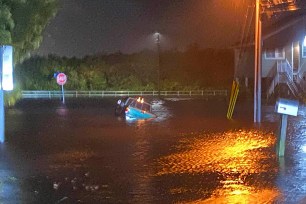 A vehicle in floodwater yesterday in Safety Harbor, Florida.