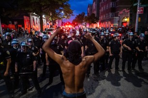 Protesters face off with the NYPD in Brooklyn during a protest after the killing of George Floyd in Minneapolis.