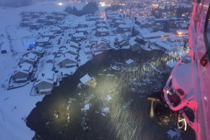 A rescue helicopter view shows the aftermath of a landslide at a residential area in Ask village, about 24 miles north of Oslo, Norway.