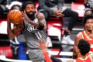 Kyrie Irving looks to make a pass during the Nets' 145-141 win over the Hawks.