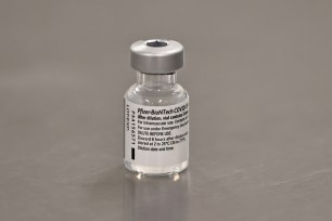 A vial of the Pfizer/BioNTech COVID-19 vaccine is seen ahead of being administered.