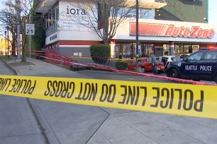 The scene of a shooting outside a Seattle Autozone where a 2-year-old girl was among those seriously injured