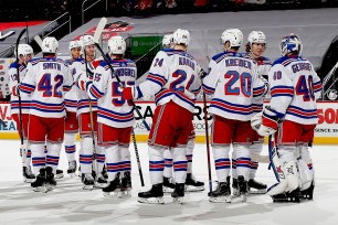 The Rangers celebrate after sweeping a four-game stand with the Devils.