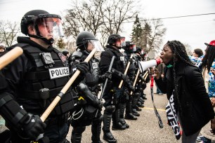 Protestors demonstrate near the corner of Katherene Drive and 63rd Ave North on April 11, 2021 in Brooklyn Center, Minnesota after the killing of Daunte Wright.