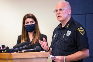 Tucson Police Chief Chris Magnus speaks as Mayor Regina Romero listens during a press conference, Wednesday, June 24, 2020, in Tucson, Ariz.