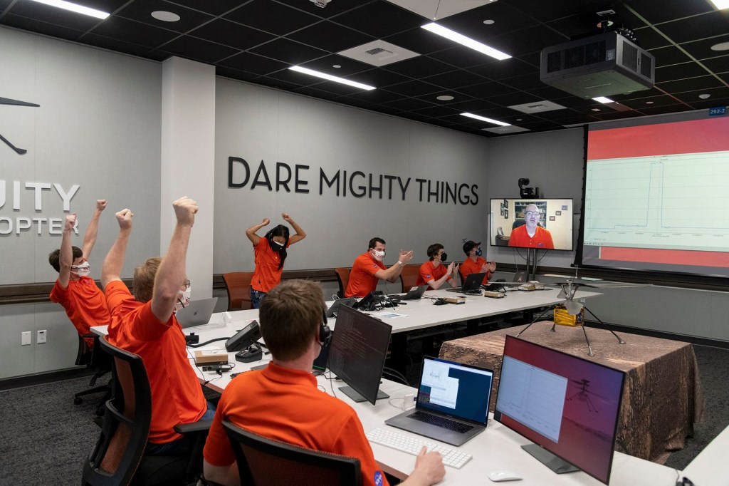 Members of NASAs Ingenuity helicopter team in the Space Flight Operations Facility at NASAs Jet Propulsion Laboratory as they react to data showing that the helicopter completed its first flight