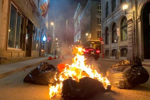 People take part in an anti-curfew protest in Montreal.