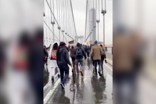 Protestors walk across and shut down the Manhattan Bridge in solidarity with Duane Wright and the Brooklyn Center community.