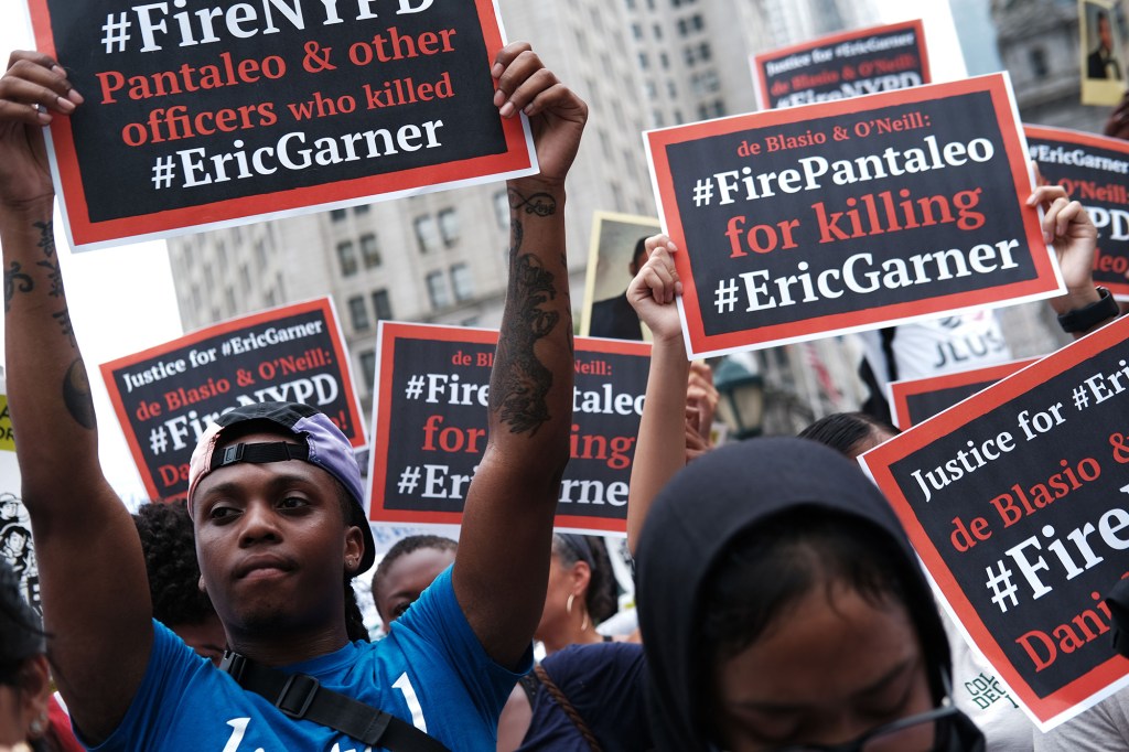 Protestors hold a rally in remembrance of Eric Garner.