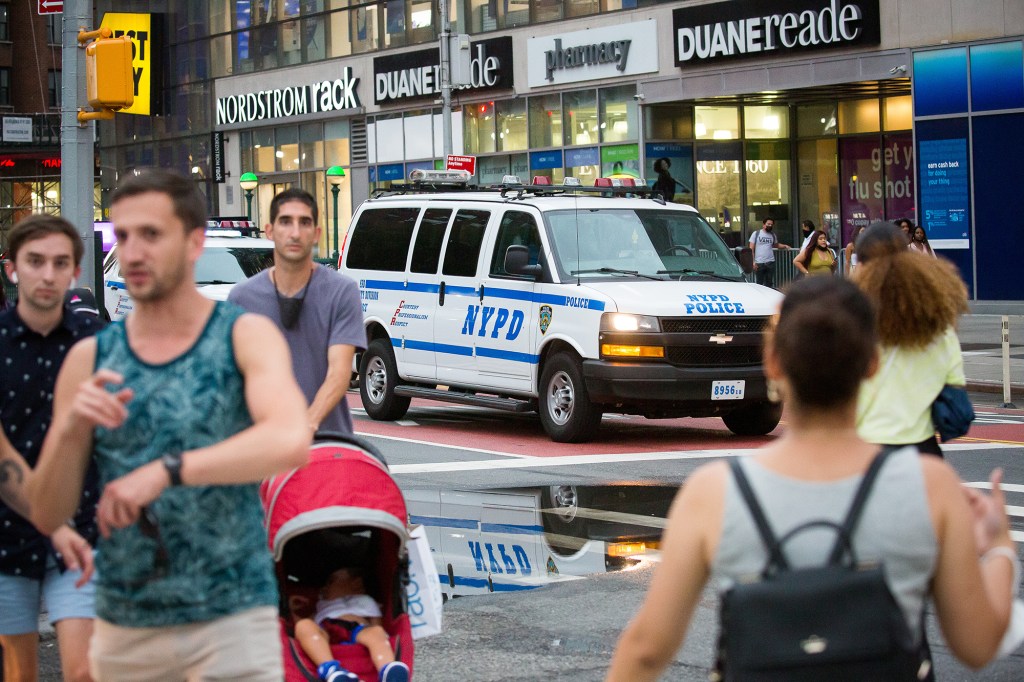 An New York Police Department (NYPD) vehicle drives past Union Square