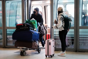 Travelers arrive at Newark Airport in New Jersey.