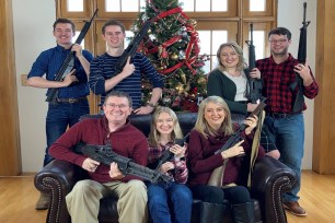 Thomas Massie posted a picture of himself and six others holding guns in a Christmas photo amid widespread outrage of the recent school shooting that took place at Oxford High School in Michigan.