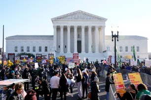 People demonstrate in front of the US Supreme Court.