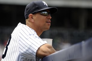 Yanks Alex Rodriguez in the dugout during today's game.