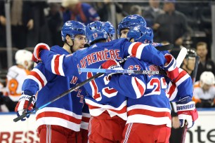 The Rangers celebrate a goal against the Flyers on Dec. 1, 2021.