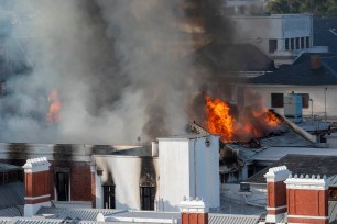 Flames engulf a building at South Africa's Parliament in Cape Town on Jan. 2, 2022.